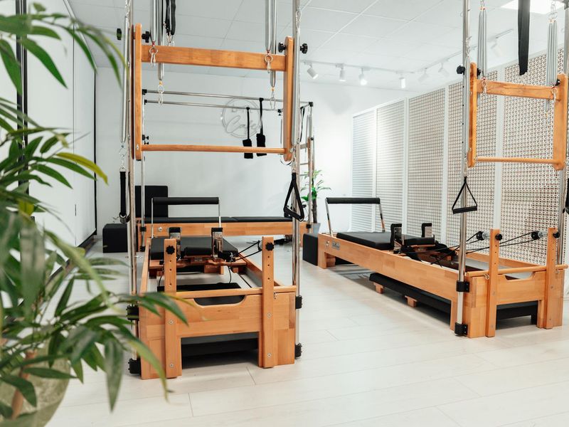 Wide shot of a clean and bright fitness studio interior